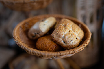 A cozy restaurant table set with a basket of fresh bread, inviting guests to enjoy a warm and welcoming dining experience — combining culinary tradition with elegant ambiance.