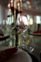 Luxury restaurant table setting featuring elegant glassware and fine dinnerware prepared for guests. Sophisticated ambiance perfect for upscale dining experiences.