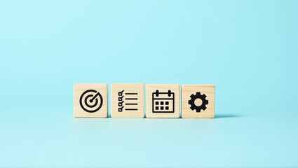 Wooden blocks with target, list, calendar and gear icons.