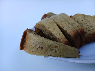 A plate of banana cake, a traditional Indonesian cake made from bananas as the main ingredient, has a soft texture and sweet taste