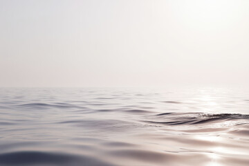 serene and minimalist view of ocean surface during foggy morning soft hues and gentle ripples ultrabright