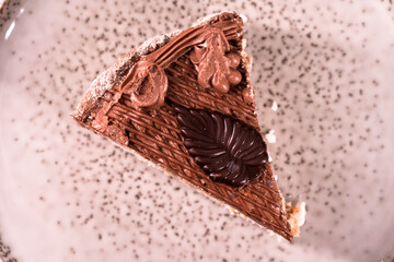 Plate with a piece of delicious homemade chocolate cake on the table. Chocolate cupcake. Dessert. Food