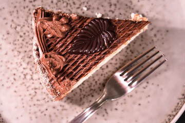 Plate with a piece of delicious homemade chocolate cake on the table. Chocolate cupcake. Dessert. Food