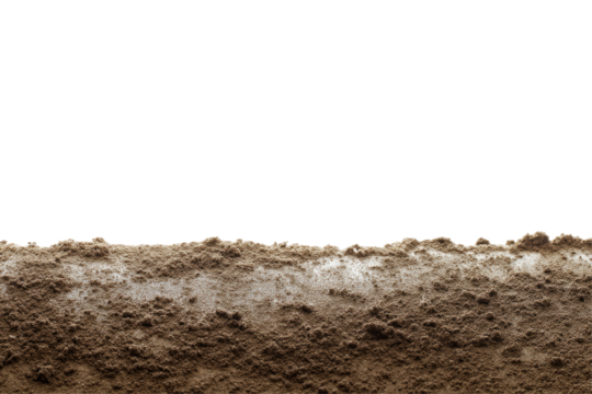 A close up view of wet brown soil with a black background showing the texture and moisture content