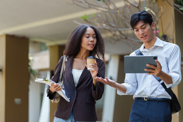 Sustainability and Engagement. A woman and a young man share thoughts while enjoying a coffee break...