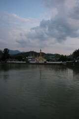 A large body of water with a small island in the middle