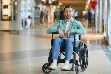 Smiling man in wheelchair enjoying shopping center accessibility