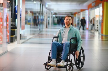 Obraz premium Customer using wheelchair shopping in mall, navigating accessibility and independence