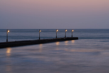 Obraz premium Evening Lights at Haraoka Pier with Long Exposure