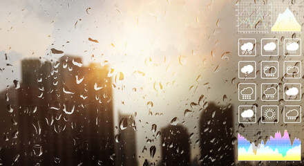Closeup on raindrops on the glass showing the blurry environment of the buildings outside after raining with weather symbol for meteorology presentation background.
