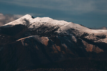 snow covered mountains on a moody winter day