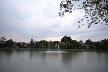 A large body of water with a fountain in the middle