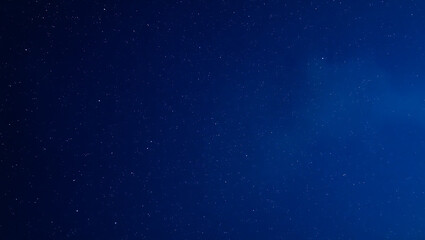 Obraz premium Starry night sky. Dark night blue sky with stars. Galaxy space. Glowing stars. New Year, Christmas and Celebration background concepts