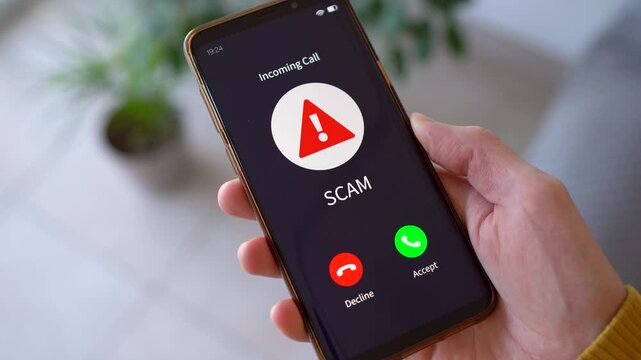 Scam Call - Mobile Phone Screen Showing An Incoming Call From A Scammer. - closeup shot