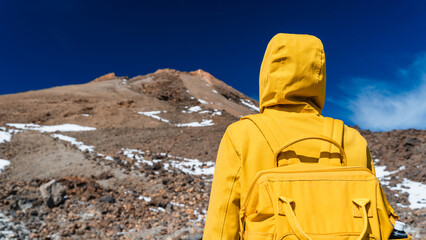 Tourist admiring rock formations in the Teide, Teide National Park, Tenerife, Canary Islands, Spain