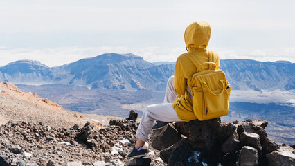 Tourist admiring rock formations in the Teide, Teide National Park, Tenerife, Canary Islands, Spain