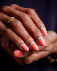 Elegant almond-shaped nails with coral and mint dual color scheme