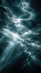 Underwater Abstract: Light dancing through the dark depths, creating an ethereal, flowing atmosphere beneath the surface.