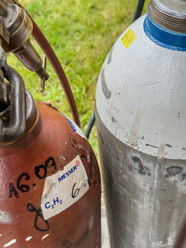 05 May 2025, Zory, Poland: Large acetylene gas cylinders (C2H2) used in metal cutting. Common in welding operations, heavy industry, and industrial gas systems. Safety-critical and high-energy process