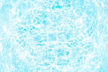 Blue water with ripples on the surface. Defocus blurred transparent blue colored clear calm water surface texture with splashes and bubbles. Water waves with shining pattern texture background.