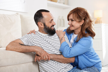Portrait of happy mature couple at home