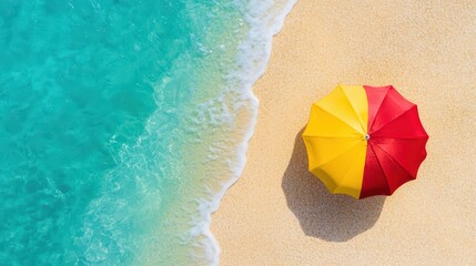 Naklejka premium Bright beach umbrella over sandy shore with turquoise water creating a relaxing summer atmosphere