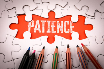 PATIENCE. White puzzle pieces and colored pencils