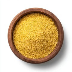 Wooden bowl of raw yellow millet grains