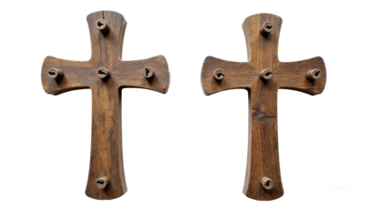 Unique wooden crosses with protruding nails displayed against a white background