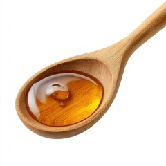 Golden honey in wooden spoon isolated