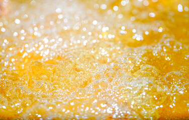 Close up bright orange Oil or beer splash texture and nature waves, Beautiful waves curve and...