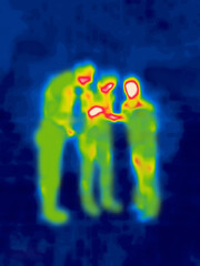 Drink a bottle for three. Three men drinking alcohol on the street standing. Image thermal imager...
