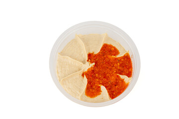 The hummus dip is photographed from above. Showing the even distribution of the red pepper paste on the creamy hummus.