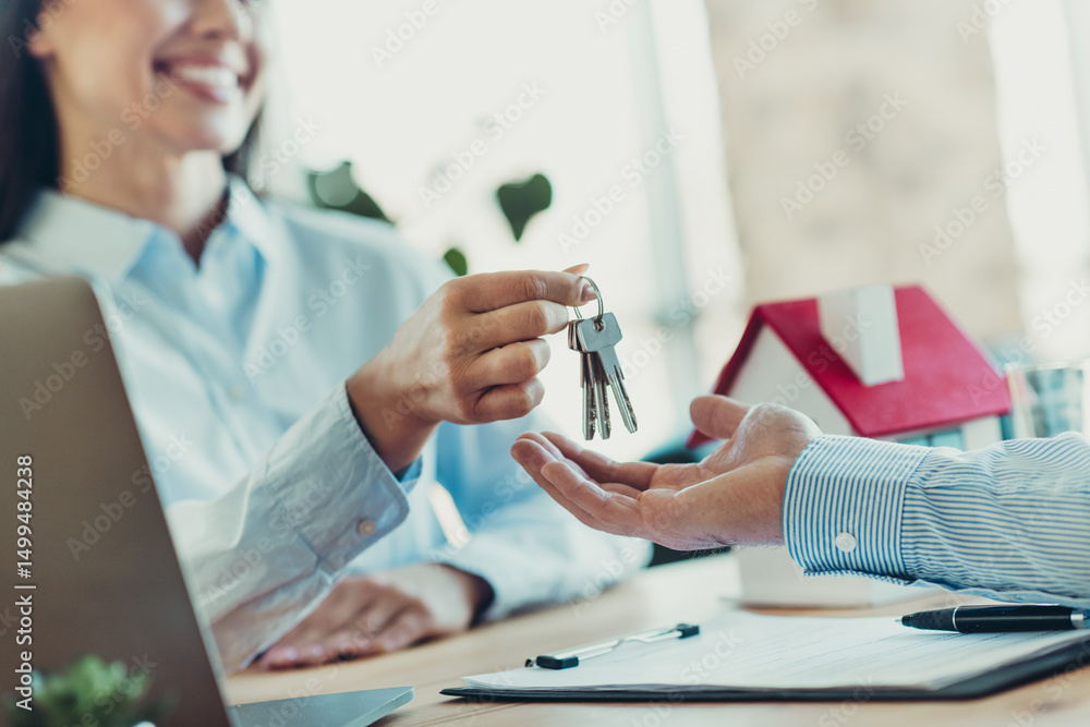 Aufkleber two professionals exchanging keys representing a business transaction in an office environment with 