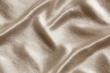 Close-up of metallic gold Glossy Satin fabric with soft folds and texture.