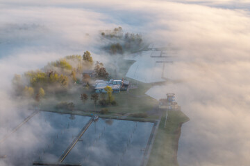Sailing start tower in morning fog on Sneekermeer, Friesland