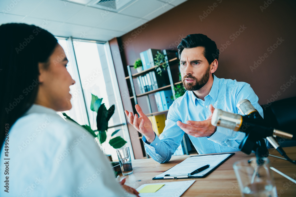 Aufkleber professional interview taking place in a modern office setting with a microphone setup highlighting 