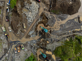 Mine Work of Excavators and Dump Trucks in Rock and Sand Quarry, Construction and mining site view from above