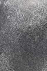 Gray textured surface highlighting subtle variations and patterns in natural stone