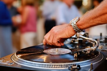 A Person's Hands Skillfully Operating a Turntable at an Outdoor Event