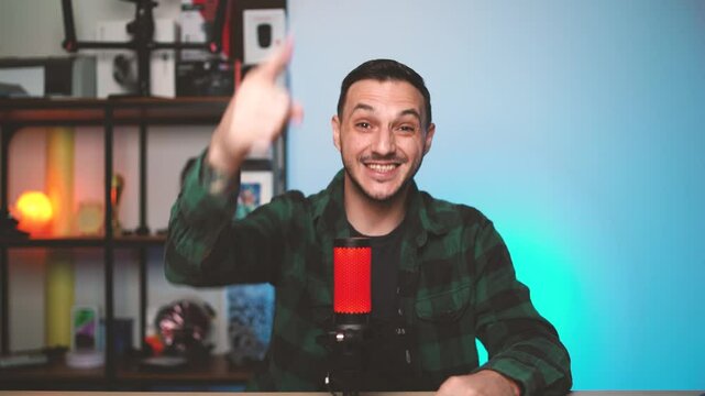 Male content creator bursts into a podcast studio with exaggerated movements and a playful mood, bringing humor and excitement to his vlogging intro.