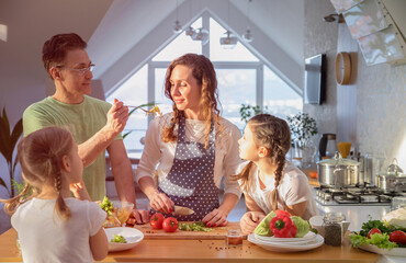 Family cooking in the kitchen at home
