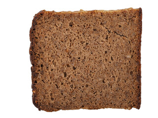 Freshly baked dark bread slice resting on a plain background showcasing texture and color variations