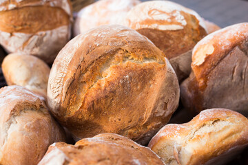 Ruddy rolls of fresh warm grain bread