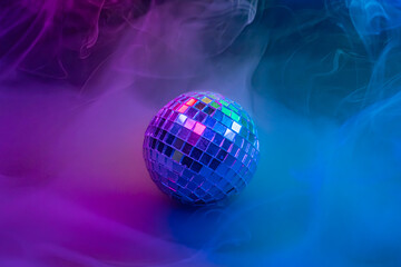 A dynamic stock image showcases a disco ball in colorful smoke, creating a kaleidoscopic effect and suggesting energy for nightclubsparties