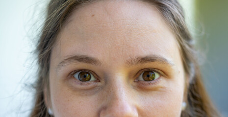 close up part of the woman's face, girl 23-30 years old, human eye looking to the side, the concept...