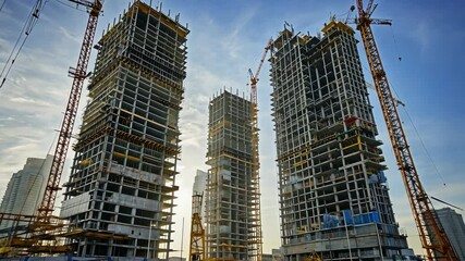Build up of skyscrapers. Construction new buildings. motion video. - Powered by Adobe