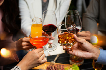Businessman with friends and whiskey for a party in a bar or restaurant.
