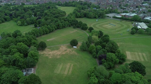 Aerial view of slow zoom to park landscape . Birkenhead, Wirral, Merseyside, Birkenhead Park, Wallasey, Bebington, Bromborough, West Kirby, Leasowe, UK, England.