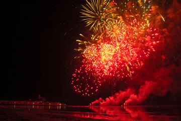 Fireworks display in Gruissan, Aude, and the South of France. The multicolored bouquets sparkle in...